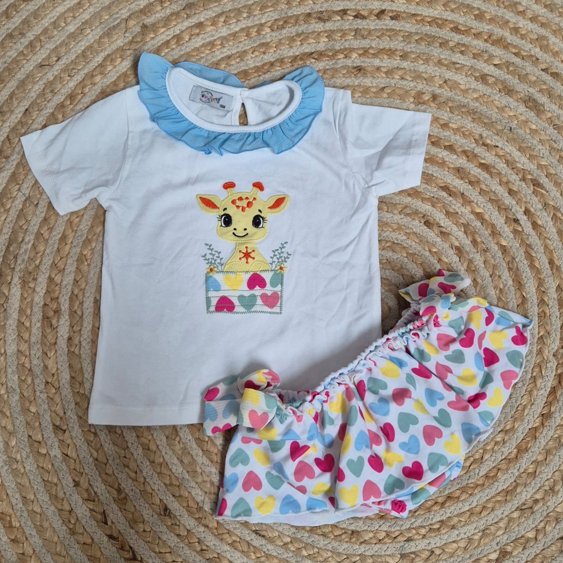 Conjunto jirafa corazones