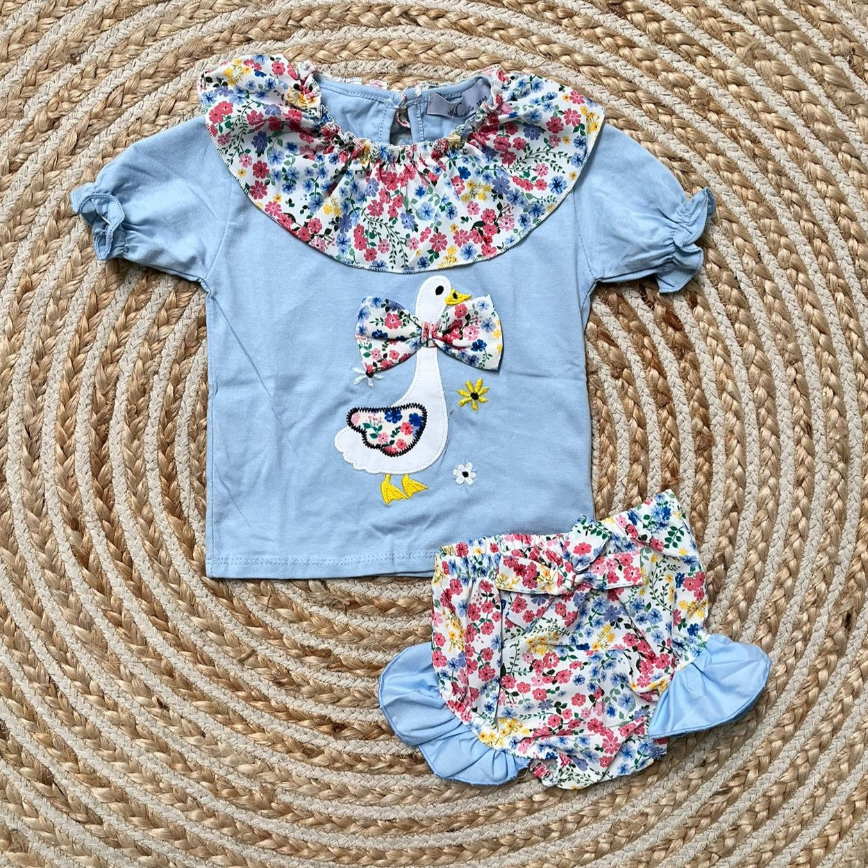 Conjunto cisne cuello flores